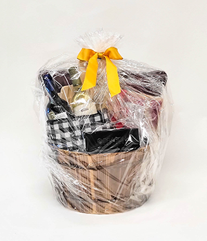 Basket with wine and cheese items