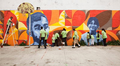 Volunteers working on mural