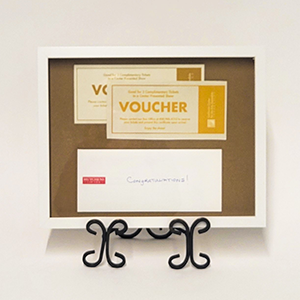 Framed gift cards for a dinner and a show